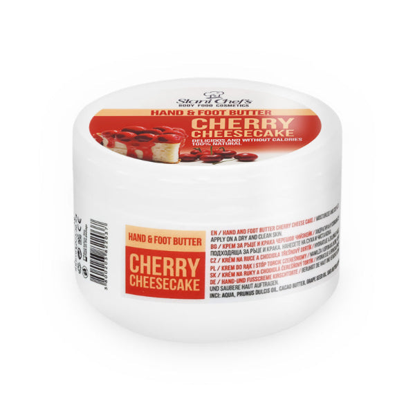 „Weiße Dose der Cherry Cheesecake Hand- und Fußcreme mit ein Stück Käsekuchen mit saftigen Kirschen und sichtbarer Produktbezeichnung.“