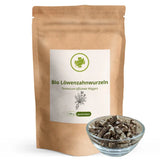 Stehende braune Papiertüte der Bio Löwenzahnwurzeln von vitalundfitmit100 mit einer gefüllten Glasschale mit getrockneten, geschnittenen Löwenzahnwurzeln davor